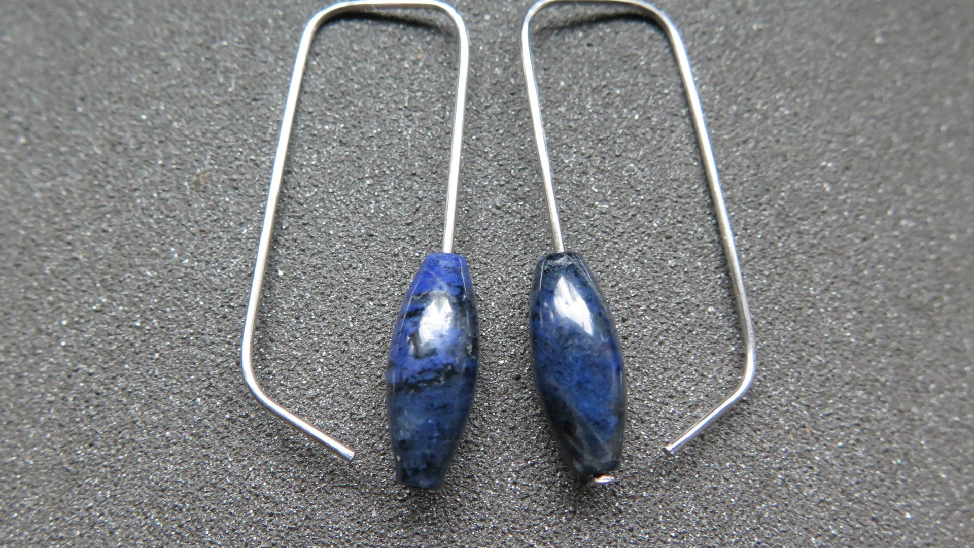 blue sodalite earrings. hypoallergenic stainless steel jewelry for sensitive ears. navy blue and black stones.