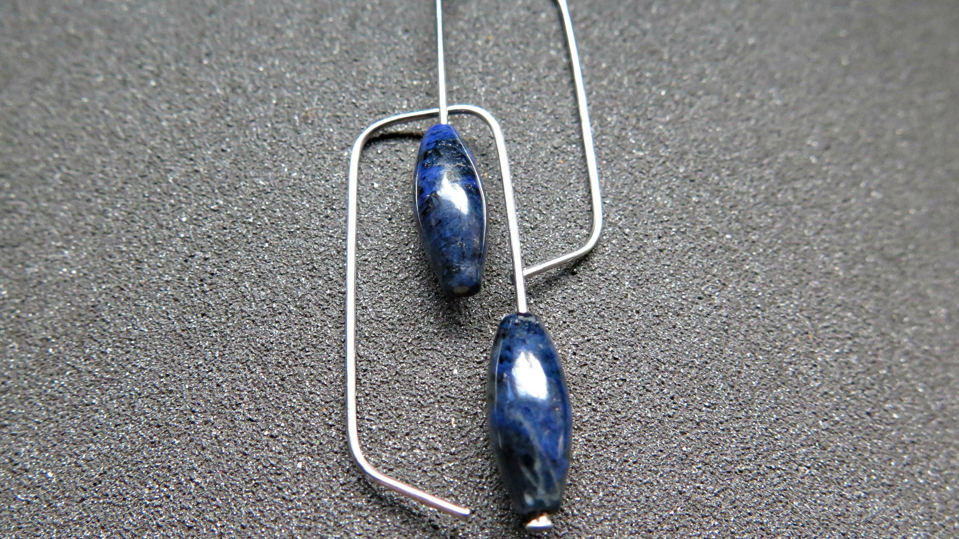 blue sodalite earrings. hypoallergenic stainless steel jewelry for sensitive ears. navy blue and black stones.