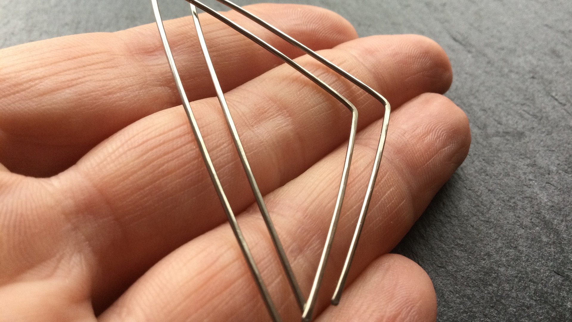triangle earrings in niobium. hammered silver hoops. hypoallergenic jewelry. nickel free hoop earrings.