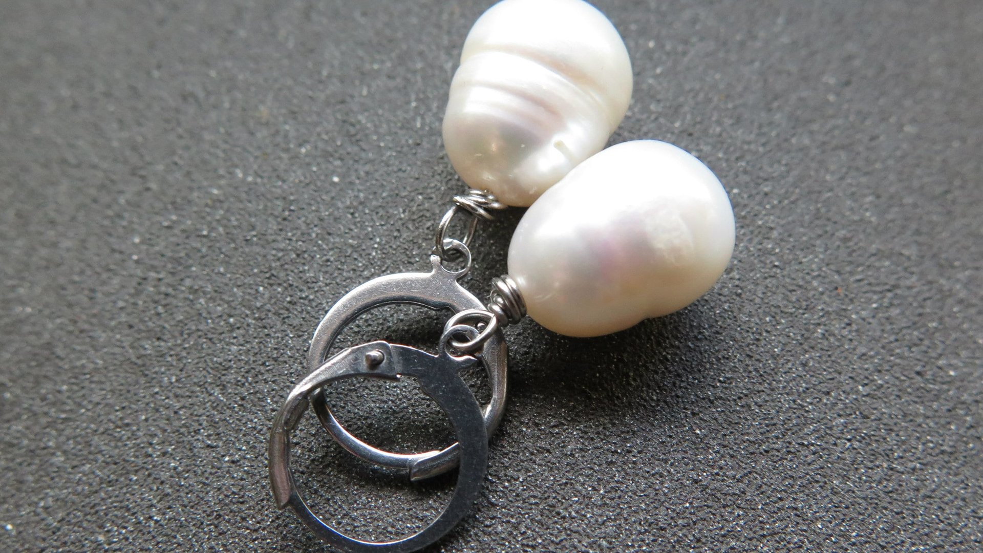 white pearl drop earrings. large freshwater pearl dangles. hypoallergenic stainless steel hoops. made in Canada.