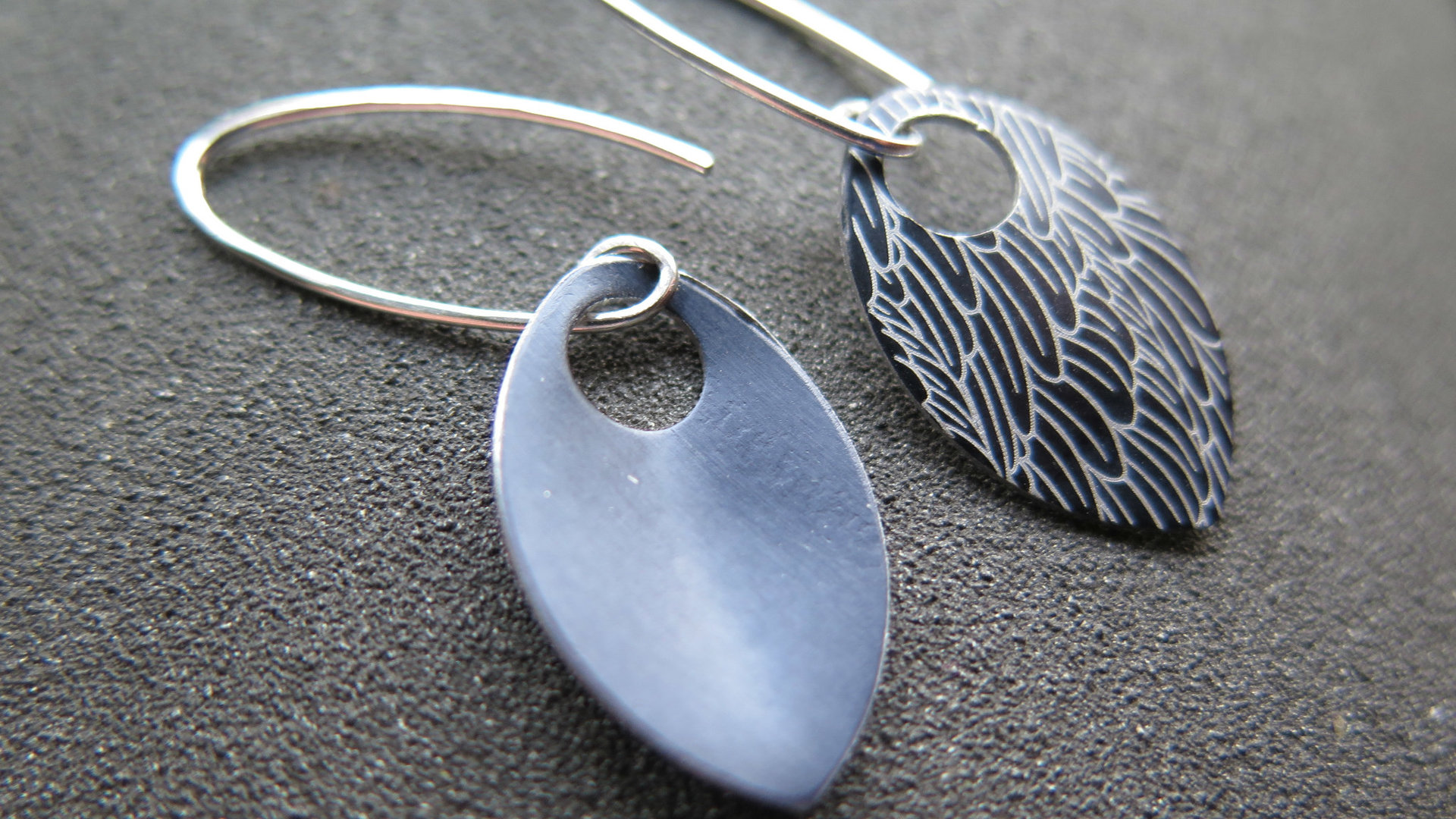 black wing earrings. anodized aluminum jewelry. sterling silver ear wire. splurge.