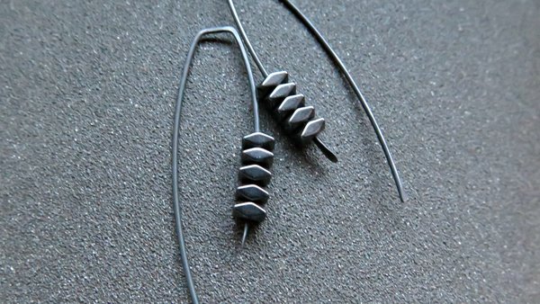 black earrings. hematite earrings in anodized niobium. hypoallergenic earwires.