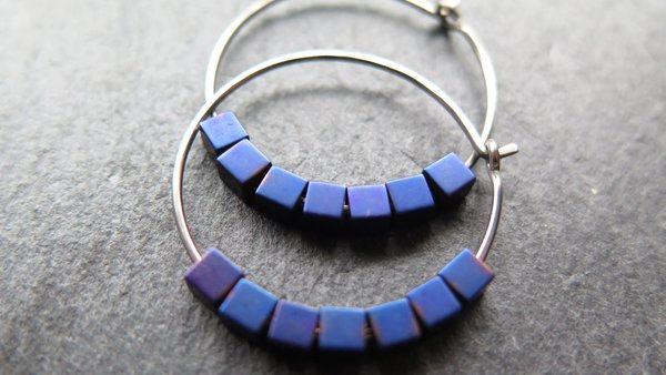 indigo earrings with hematite cubes. hypoallergenic niobium hoops for sensitive ears. modern purple blue jewelry.